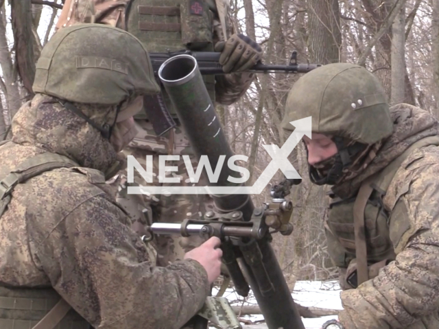 Crews of 82-mm Podnos mortars from a motorized rifle unit destroy identified camouflaged strongholds of the Ukrainian Armed Forces, in Ukraine. Note: Picture is a screenshot from the video. (Ministry of Defense of the Russian Federation/Clipzilla)