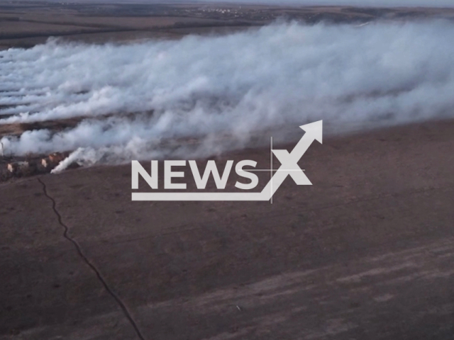 Military personnel create camouflage using TDM-2k thermal smoke machines to advance tanks and armored vehicles during the assault on populated areas and strongholds of the Ukrainian Armed Forces. Note: Picture is a screenshot from the video. (Ministry of Defense of the Russian Federation/Clipzilla)