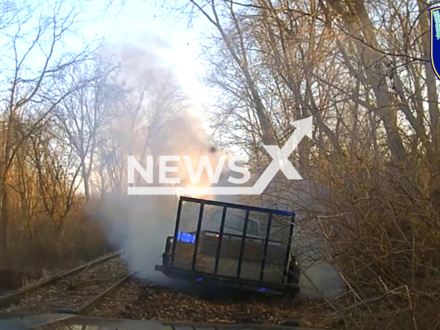 Police chase and arrest suspect in Chevrolet Silverado, towing a stolen trailer, in Kalamazoo, Michigan, USA, on Wednesday, March 13, 2024.Note: Picture is screenshot from a video. (Kalamazoo Public Safety/Clipzilla)