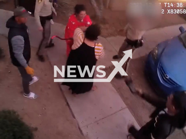 Officers Marcolini, Officer Manzanedo, and Officer Silva from LVMPD South Central Area Command save a woman from a fire, in Las Vegas, Nevada, USA, in December, 2023.
Note: Picture is screenshot from a video. (LVMPD/Clipzilla)