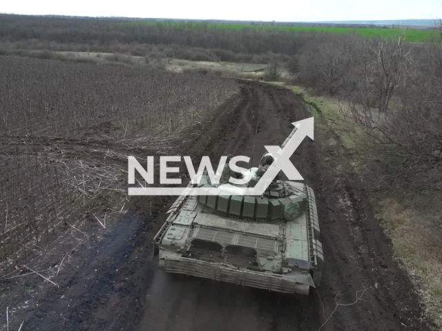 Russian crews of the T-72B3 tanks, firing from a closed firing position, destroy Ukrainian artillery and mortar crews in the border area of ​​​​the settlement of Nekhoteevka, Russia. Note: Picture is a screenshot from the video. (Ministry of Defense of the Russian Federation/Clipzilla)