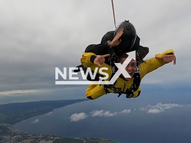 Sgt. 1st Class Jonathan Lopez, team leader of the ArmyGK tandem section and native of Dorado, Puerto Rico , makes a tandem skydive over Aguadilla, Puerto Rico, during the team’s first tandem camp of 2022. Note: Picture is a screenshot from a video (@DeptofDefense/Clipzilla)