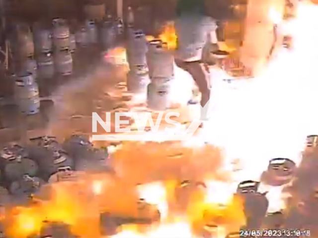 Picture shows a worker and fire at the gas bottling plant in Glogow, Lower Silesian Voivodeship, southwestern Poland on Wednesday, May 24, 2023. The worker used heat gun that caused huge explosion. Note: Picture is a screenshot taken from a video. (National Labor Inspectorate in Legnica/Newsflash)