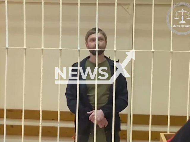 Photo shows Maxim Lyutyi, 43, from the Krasnodar Region in Russia, in court in Sochi, Russia on Tuesday, April 16, 2024.  He was jailed for eight years for causing the death of his newborn son. Note: Picture is screenshot from a video. (@opskuban/Newsflash)