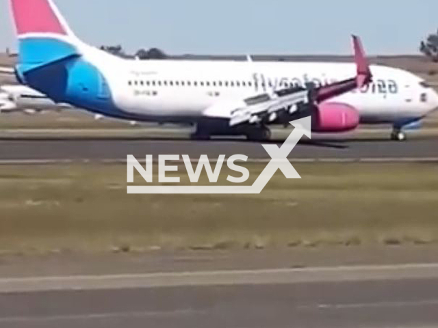 FlySafair plane bound for Cape Town loses a wheel during take-off in South Africa, undated. The plane reportedly suffered damage to one of its rear tires. Note: Picture is screenshot from a video (Newsflash)