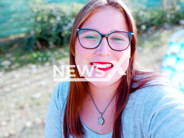 Fiamma Basso, in her twenties, poses in undated photo. She died in a field in Ausonia, Argentina. Note: Private photo taken from social media. (Newsflash)