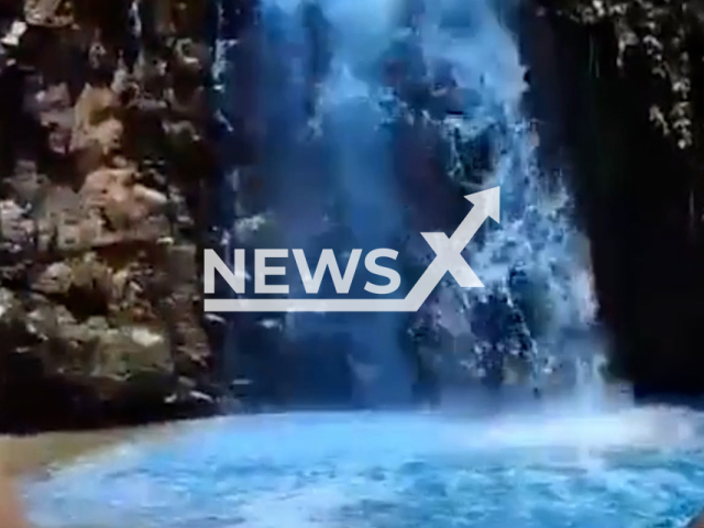 Picture shows a  waterfall dyed blue for a baby's gender reveal, in Tangare da Serra, Brazil, on Sunday, Sept. 25, 2022.   Secretary of State for the Environment of Mato Grosso is investigating.
  Note: This picture is a screenshot from the video . (Newsflash)