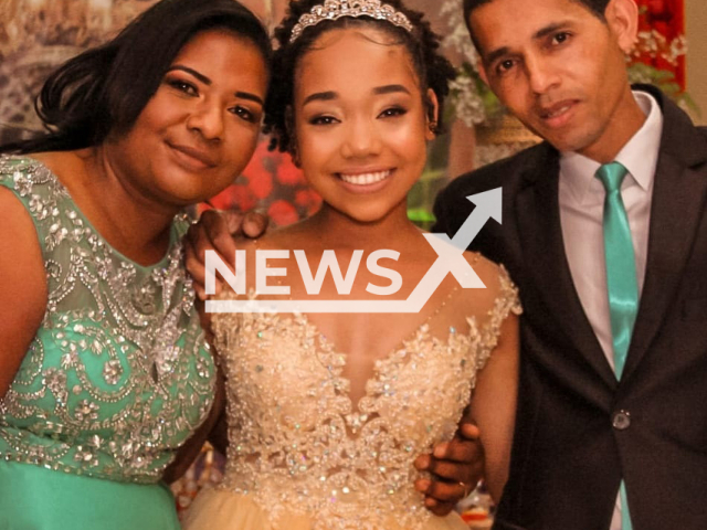 Liane and Emily Ulguin da Rocha (middle) pose in undated photo. They died buried after house is hit by stone in RS, Brazil. Note: Private photo taken from social media. (Newsflash)