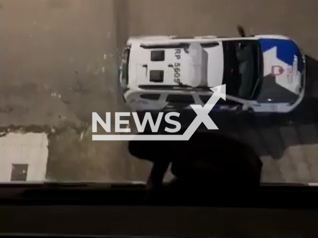 Man falls from building and hits vehicle while escaping police in Marechal Floriano, Brazil, undated. He is suspected of being involved in drug trafficking.Note: Picture is screenshot from a video. (Newsflash)