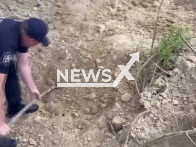 Police rescue a man in his sixties who was stabbed and buried alive by an 18-year-old suspect in Ustia, Glodeni district, Moldova, on Monday 13 May, 2024. The man survived. Note: Picture is screenshot from a video (General Inspectorate of Police of Moldova/Newsflash)