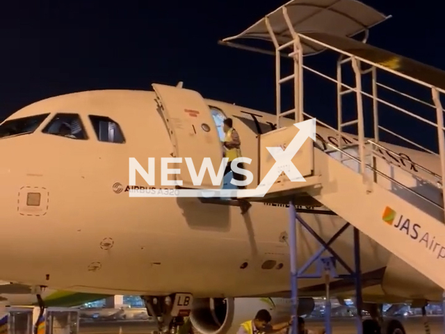 Airline worker falls from a plane not realizing the steps were moved away in Jakarta, Indonesia, undated. No casualties were reported.Note: Picture is screenshot from a video. (Newsflash)