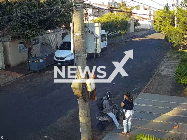 Driver runs over criminal trying to steal from a nurse in Uberlandia, Brazil, Tuesday, May 14, 2024. The woman's cell phone was not stolen and the suspect fled. Note: Picture is screenshot from a video (Newsflash)