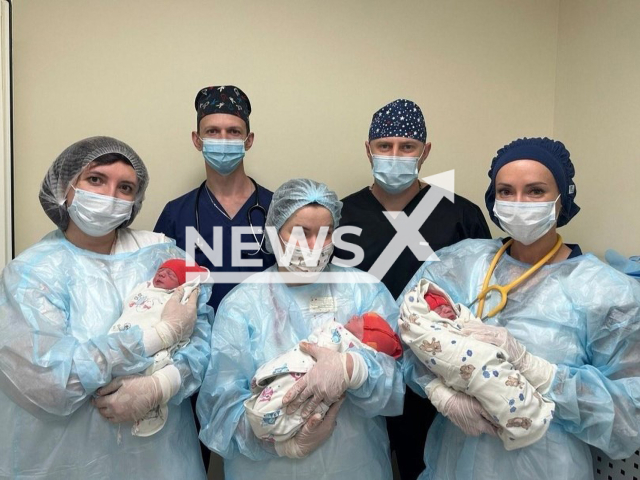 Doctors hold three newborn boys at clinic in Rostov-on-Don, Russia in May, 2024. Doctors alleged the mother of boys had appendicitis but she was pregnant.  Note: Photo is obtained from the State budgetary institution Regional Perinatal Center in Rostov-on-Don. (@perinatal_rostov/Newsflash)