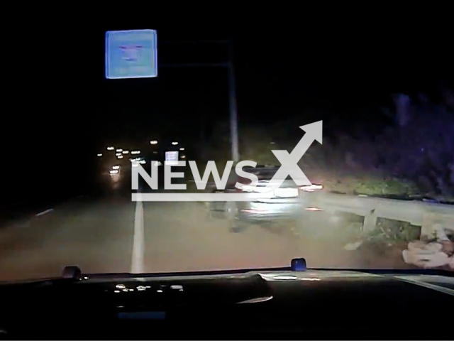 The teen jumping from the stolen car during a police chase in Whitehall, Ohio, USA. Note: This picture is a screenshot from the video (@WhitehallPD/Newsflash).