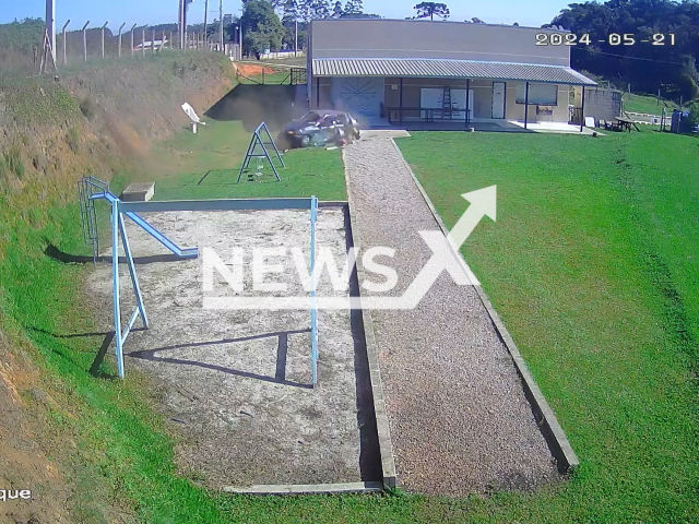 Car falls into the backyard of a house in Sao Jose dos Pinhais, Brazil, Tuesday, May 21, 2024. A nine-month-old baby died. Note: Picture is screenshot from a video. (Newsflash)