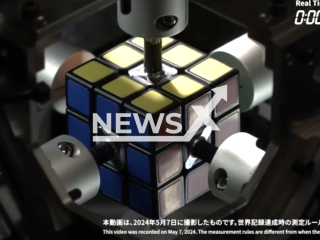 The robot solves a Rubik's cube on May 7, 2024. Mitsubishi Electric has been awarded the Guinness World Record title for the fastest robot to solve a puzzle cube.  Note: Picture is screenshot from a video (Mitsubishi Electric/Newsflash)