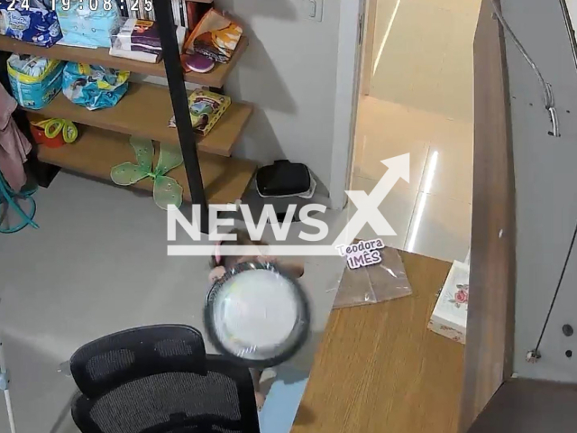 One-year-old baby tries to grab her sister's cake and drops it in Vila Velha, Brazil, May 24, 2024. The video has over 2 million views. Note: Picture is screenshot from a video (@JoaoeFerraz/Newsflash)