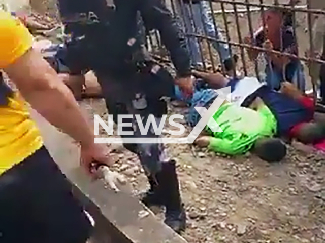 Shot people lie on the ground after an armed attack in Ventanas, Ecuador, undated. Seven people died.Note: Picture is screenshot from a video. (Newsflash)