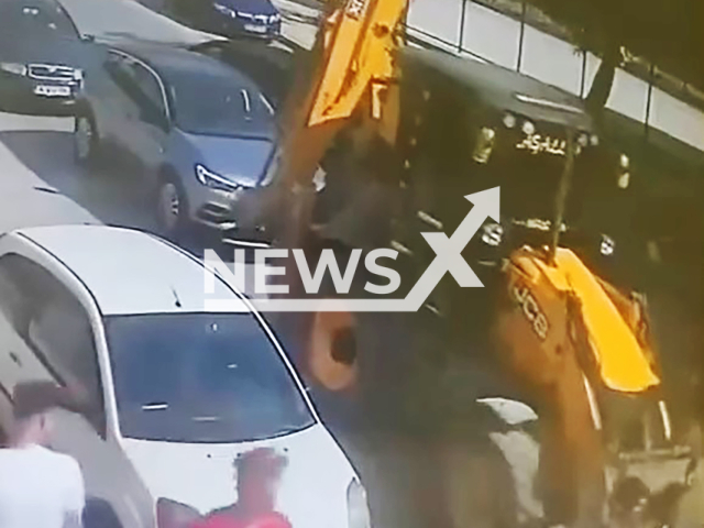 Young couple hitchhiking continue their journey in front of a digger they stopped in Izmir, Turkey, undated. Note: Picture is screenshot from a video. (Newsflash)