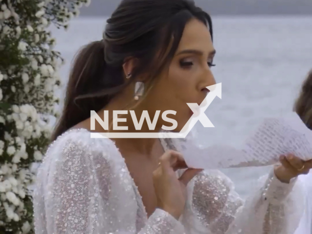 Bride blows dust off her wedding vows after waiting three years to get married in Vitoria, Brazil, undated. Ithanara Bragio, 34, waited 3 years to marry Pedro Paulo Moyses, 35.Note: Picture is screenshot from a video. (@fpvdanyllo, @ithanarabragio/Newsflash)