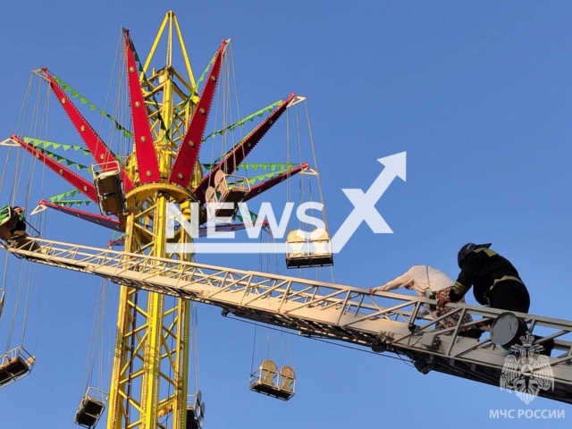 Rescuers evacuate people from the attraction ride Swing Tower in Nalchik, Kabardino-Balkaria, Russia on Sunday, June 16, 2024. In total, 13 people were rescued. Note: Photo is obtained from the Ministry of Emergency Situations of the Russian Federation. (@mchs_official/Newsflash)