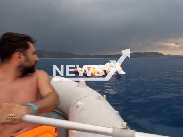 Gokhan Aslan rows toward Ayse Sila Gucer,  on Salda Lake, Turkey, on Tuesday, June 18, 2024. She was dragged away from the beach on an inflatable. Note: Picture is screenshot from a video. (Newsflash)