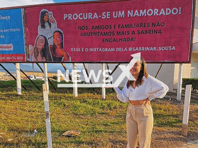 Sabrina Rosete Sousa sees the billboard to help her you find a boyfriend that her family put up, in Palhoca, Brazil, undated. She is 22 years old and has never dated. Note: Private photo taken from social media.   (@sabrinar.sousa/Newsflash)