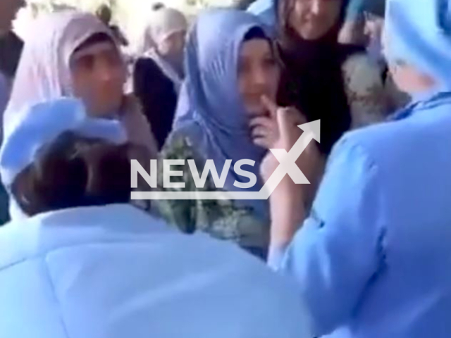 Photo shows the moment hospital staff in Tajikistan did not allow women with headscarves to enter the Hospital. The staff changed the way the women wore the headscarves. Note: Picture is screenshot from a video (Newsflash)