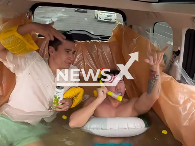 Footage shows two guys driving in a swimming pool inside a car in Astana, Kazakhstan, undated. The vide of it went viral. Note: Picture is screenshot from a video (@zhanabylov_e/@nnnurdaylet/Newsflash)