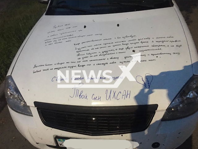 Photo shows car hood covered with felt-tip pen writings in  Saran, Kazakhstan, undated. Woman left heart breaking message to her ex on the hood of the car on behalf of her not born yet son. Note: Private photo taken from local media. (Newsflash)