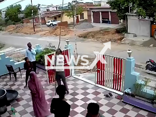 Man is electrocuted in Mahoba, India, undated. He was carrying a bamboo stick which touched an electric wire. Note: Photo is a screenshot from a video. (Newsflash)