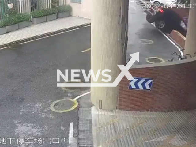 Porsche crashes into retaining wall in Foshan, China, on 24th April 2022. Note: Picture is a screenshot from a video (AsiaWire)