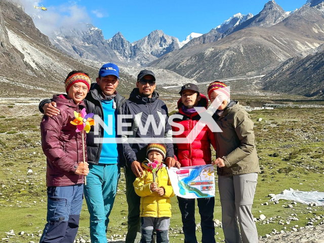 Picture shows the Singaporean family with the hiking team, undated. The woman was slammed for bringing her son to Mount Everest as the boy got sick. Note: Private photo. (@engagingatlas/Newsflash)