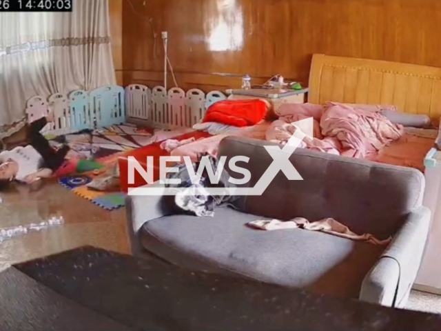 Mother rushes to her crying baby and falls on the floor breaking a bone in Longyan, China, on 26th April 2022. Note: This picture is a screenshot from the video (621630878/AsiaWire).