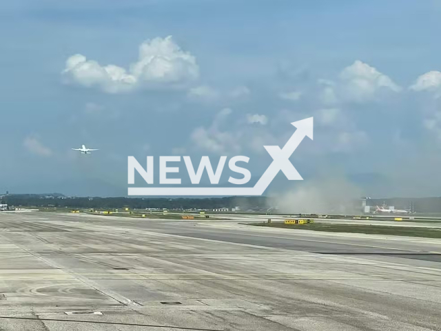 Picture shows the smoke cloud where the Latam plane hit its tail, undated. It occurred during takeoff. Note: Private photo taken from local media. (Newsflash)