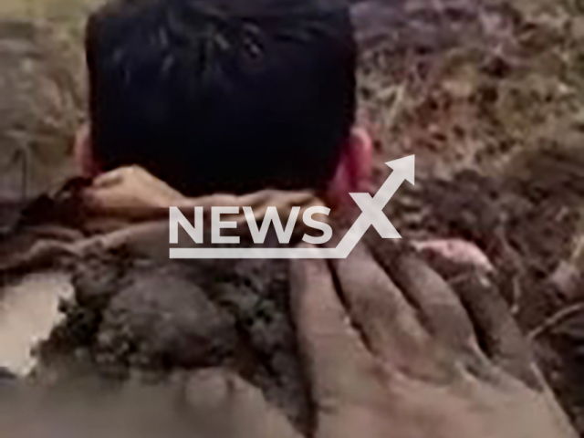 Villagers bury two brothers into the ground after being struck by lightning in the Asma village of Igdir in Turkey, undated. The medical teams took the two brothers to the hospital.Note: Photo is a screenshot from a video. (Newsflash)