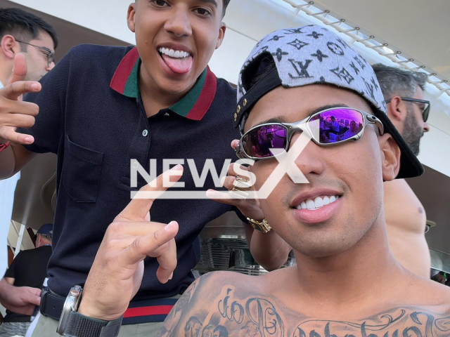 Picture shows influencer Nino, on the left, and his brother Deric, undated.  Nino Abravanel's brother, Deric Elias Costa Silva, shot around 11 times at bricklayer Tarcisio Gomes da Silva in Sao Paulo, Brazil. Note: Private photo taken from social media. (@vulgo.dee/Newsflash)