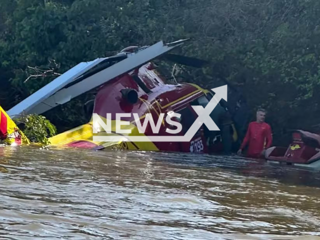 Picture shows the firefighters' helicopter that made forced landing on the Araguaia River, in Goias, Brazil. The pilot suffered minor injuries. Note: Fire department photo. (Newsflash)