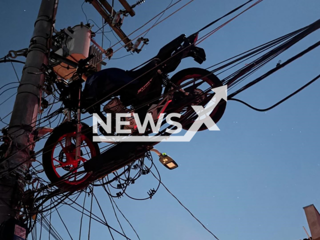 Picture shows the motorcycle that was lifted by a hot air balloon in the East Zone of Sao Paulo, Brazil, undated. Seven neighborhoods were left without electricity. Note: Private photo taken from social media. (@kiko46d/Newsflash)