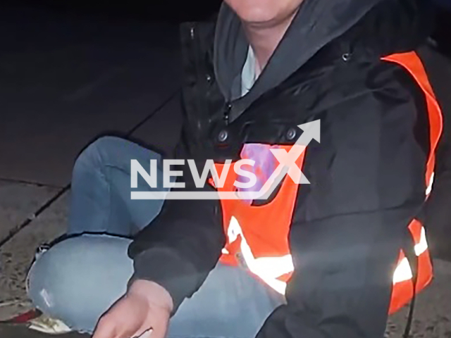 Image shows Malte Nierobisch, 21, glued at the Cologne Bonn Airport, North Rhine-Westphalia State, Germany, undated photo. The airport temporarily stopped all flights after Last Generation activists blocked a runway on Wednesday, July 24, 2024. Note: Photo is a screenshot from a video. (Newsflash)