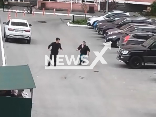 A woman kicks and chases a police officer in Tyumen, Russia, undated. Local MP reacted to the situation. Note: Photo is a screenshot from a video. (Deputy of the Tyumen Regional Duma Ivan Vershinin/Newsflash)