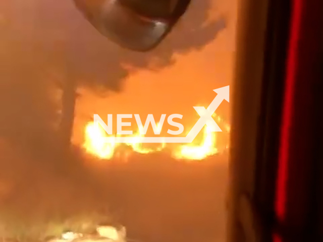 Video shows firemen in the middle of raging fire in Tucepi, Croatia, undated. The fire was brought under control.Note: Photo is a screenshot from a video. (Newsflash)