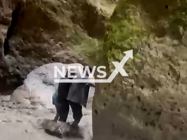 Inspectors of the Ministry of Natural Resources help tourists to get out from a cave of Karadakhskaya Tesnina, Republic of Dagestan, Russia on Saturday, July 27, 2024. The tourists were blocked in the cave as a result of a fast rise in water level.Note: Photo is a screenshot from a video. (@minprirodyrd/Newsflash)