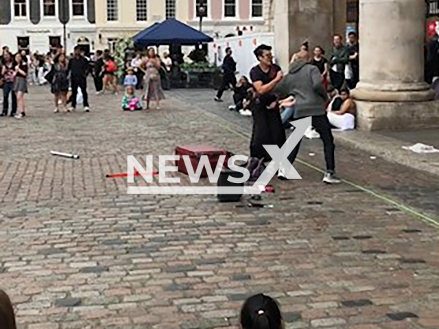 Stranger punches the Singaporean busker Bryan Wong in London, Wednesday, July 23, 2024. His stage name is Brylights.
Note: Photo is screenshot from a video (@brylights/Newsflash)