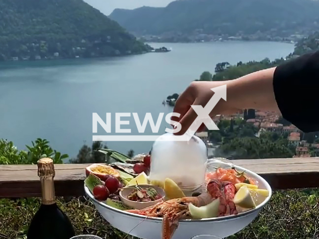 Picture shows the view from the Il Gatto Nero restaurant in Cernobbio, Italy, undated. It is a restaurant with a 15 euro cover charge. Note: Image is a screenshot from video. (@ristorantegattonero/Newsflash)