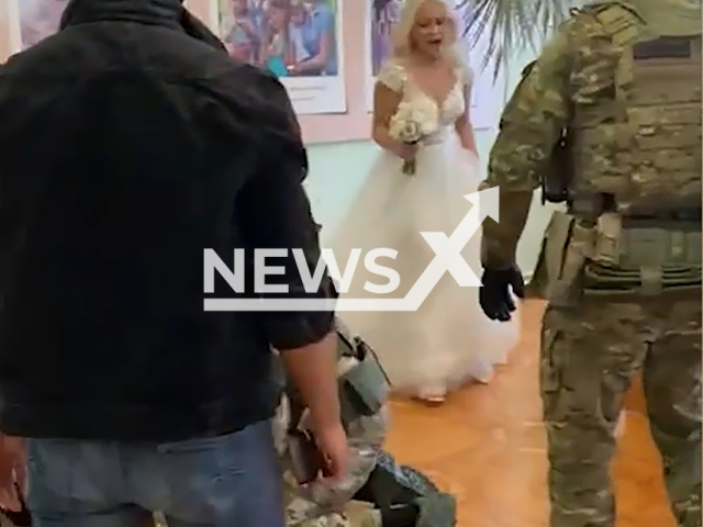 Police officers storm the registry office and arrest the groom, 29, right during his marriage ceremony in Blagoveshchensk, Amur Oblast, Russia on Saturday, June 1, 2024. He was charged with causing grievous bodily harm Note: Photo is a screenshot from a video. (Newsflash)