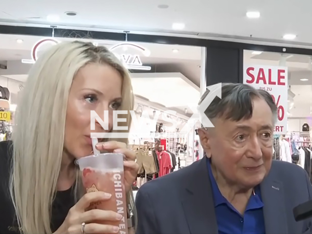 Image shows Richard Lugner, 91, and his wife Simone, 42, during her first day at the new position, undated photo. She was appointed managing director of his shopping centre 'Lugner City' in Vienna, Austria. Note: Photo is a screenshot from a video. (Newsflash)