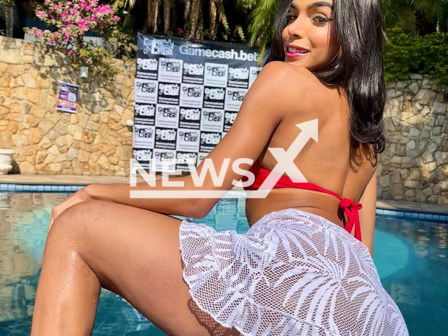 Manuella Ribeiro poses in undated photo. She was attacked after promoting a gambling platform. Note: Private photo taken from social media. (@mhanucomh1/Newsflash)