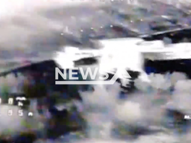 Image shows Russian units demolishing a Ukrainian Baba Yaga drone, undated photo. It took place in Kursk, Kursk Oblast, Ukraine, August 11, 2024. Note: Photo is a screenshot from a video. (Clipzilla)