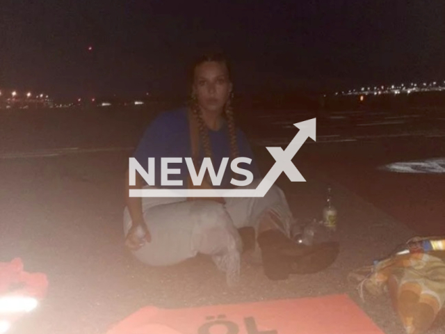 Climate activist Anja Windl, aged 27, from Bavaria, Germany, poses in undated photo. She glued herself to the tarmac at Stuttgart Airport, Germany. Note: Licensed content. (Last Generation/Newsflash)